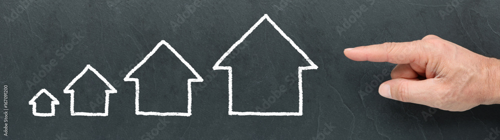 Different Size Houses on a blackboard