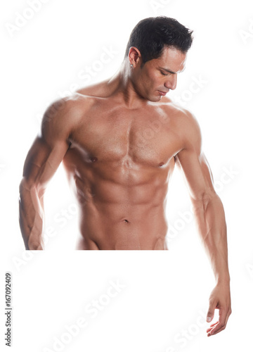 Muscular bodybuilder guy standing and posing on white background