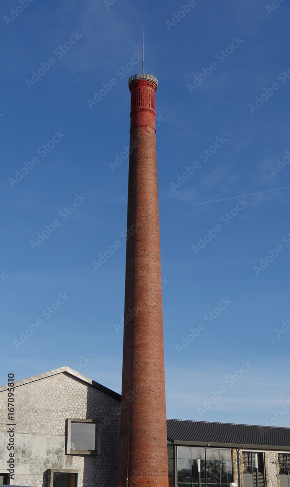 Old red brick factory chimney