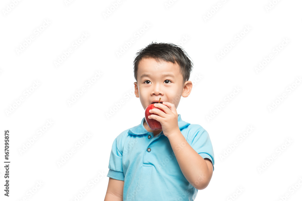 Asian baby boy holding and eating red apple, isolated on white Asian baby boy holding and eating red apple, isolated on white