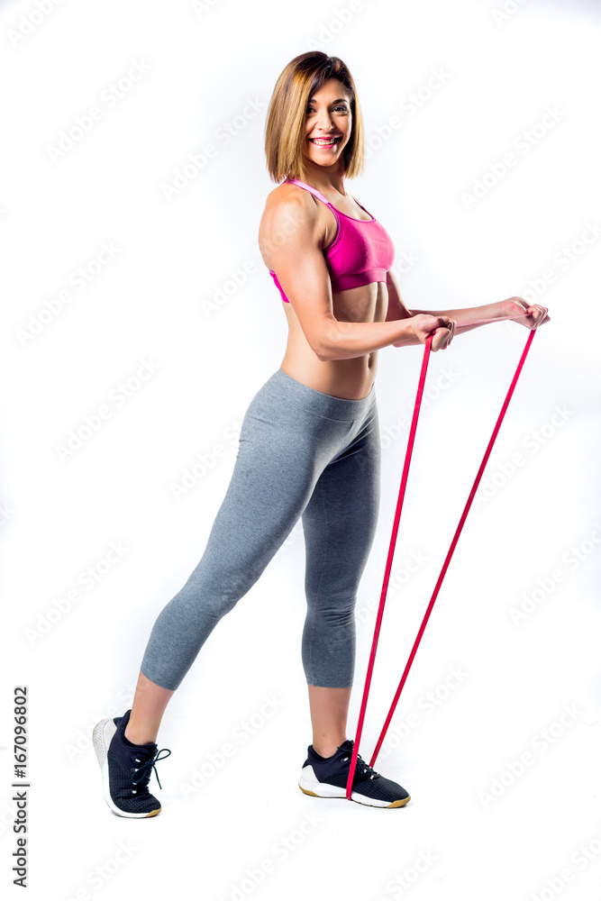 Fitness woman doing exercises with elastic bands Fitness woman doing exercises with elastic bands