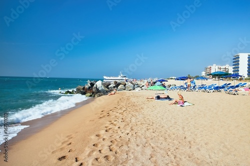 Beach at the Mediterranean Sea in Malgrat de Mar, Spain. photo