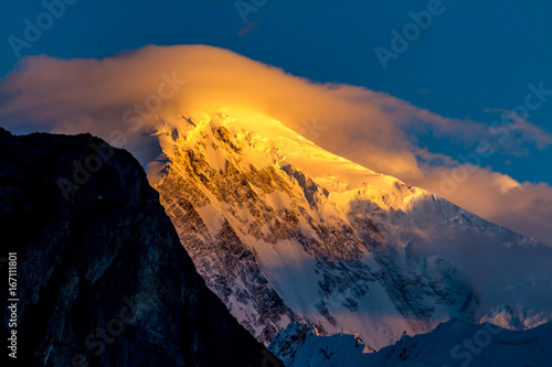The sunset view of Mt. Diran from the Hunza Valley, Pakistan.