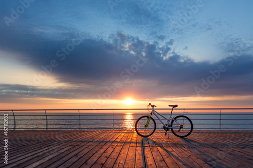 Silhouette of a parts bicycle, handlebar on the beach 