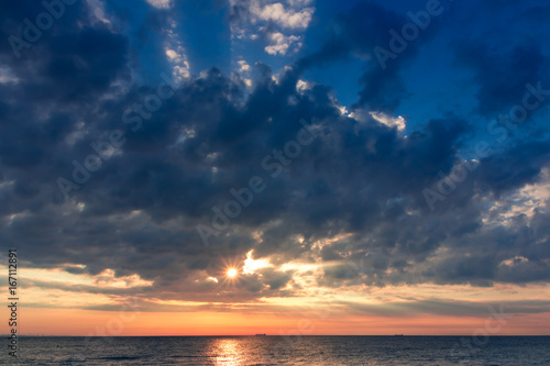 Beautiful sunrise in the sea with clouds