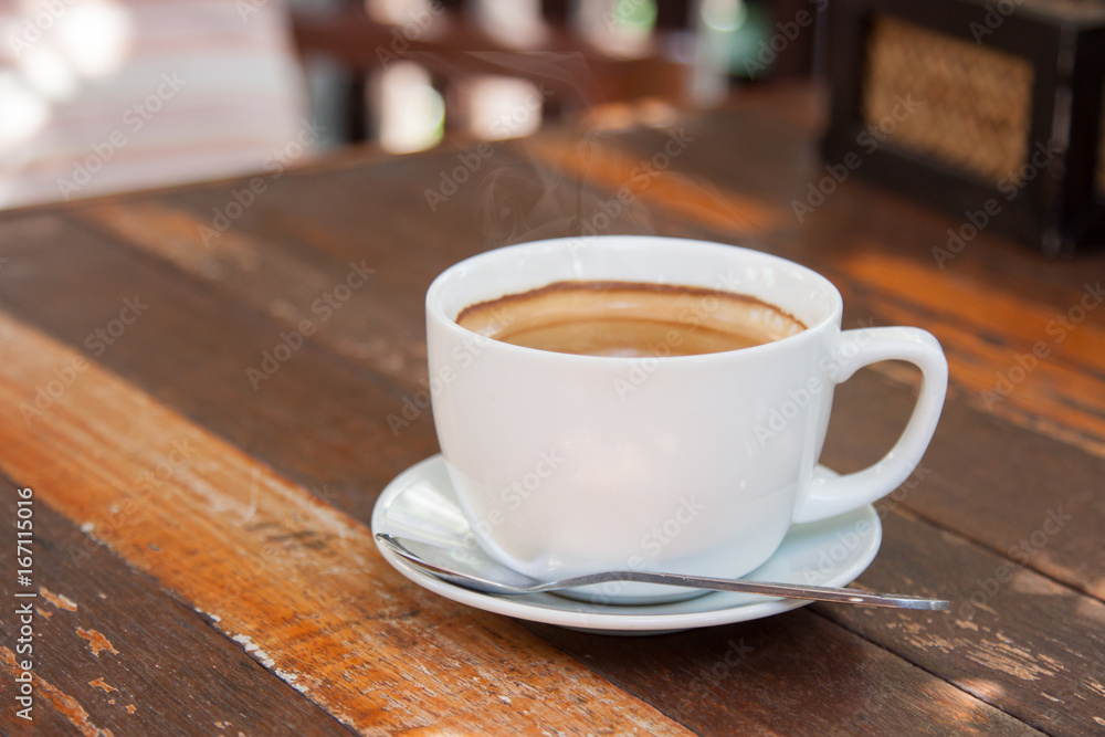 Hot espresso coffee on wooden table Hot espresso coffee on wooden table