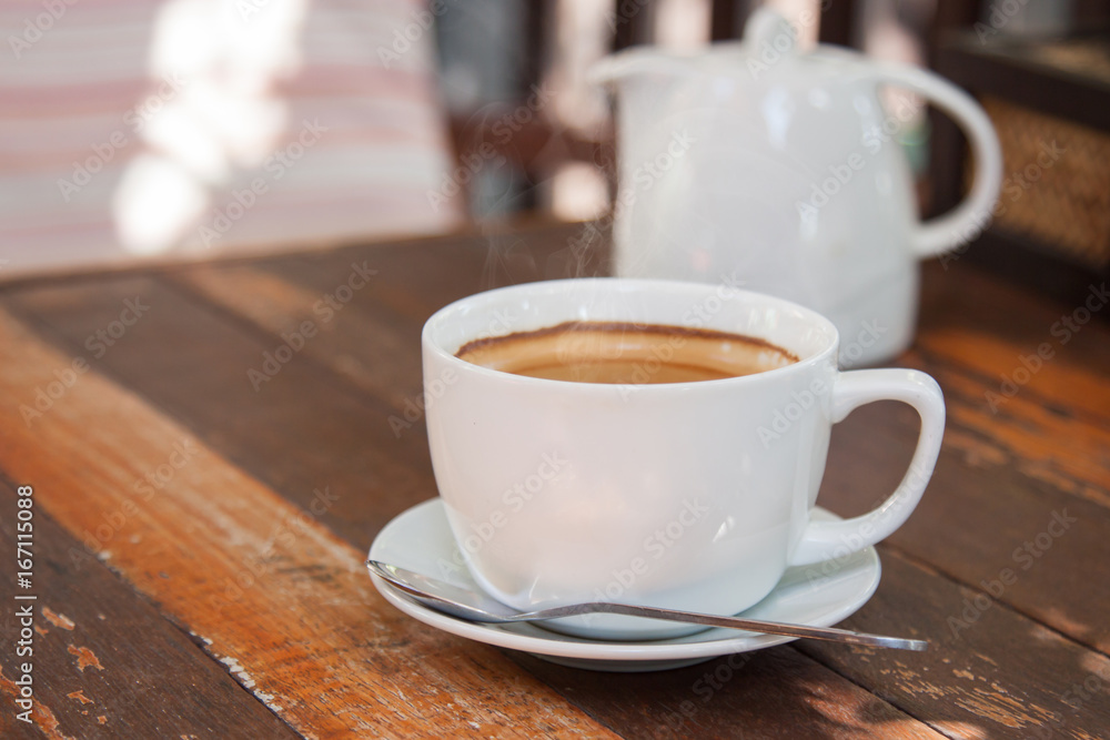 Hot espresso coffee on wooden table Hot espresso coffee on wooden table