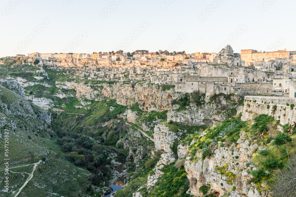 ancient ghost town of Matera (Sassi di Matera) reflect to the red sun rise, southern Italy
