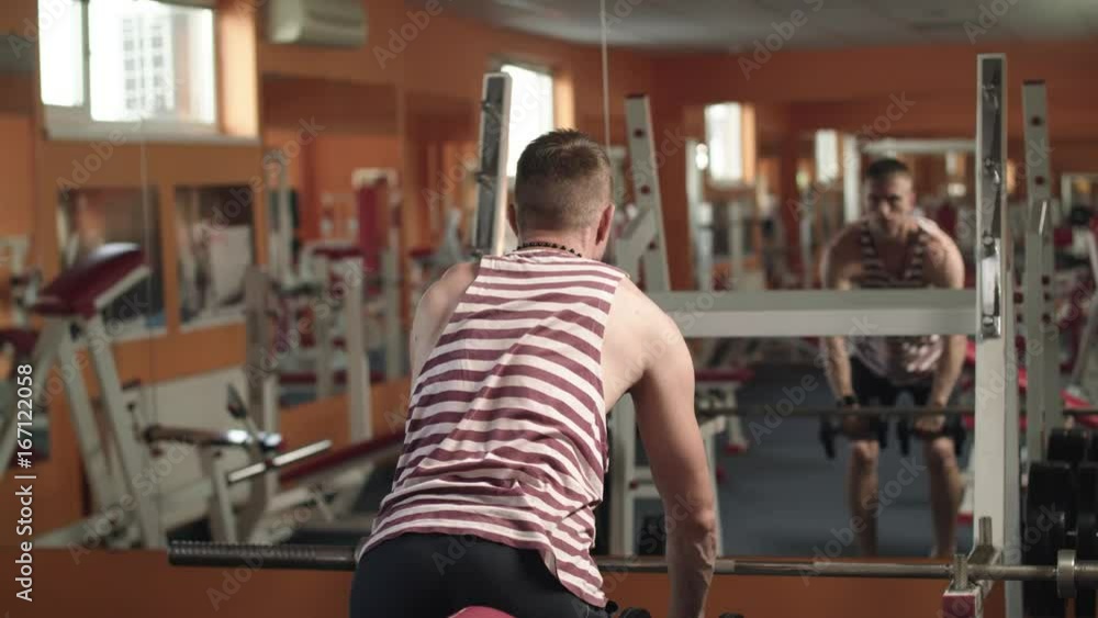 Athletic Man Working At The Gym. Athletic Man Working At The Gym.