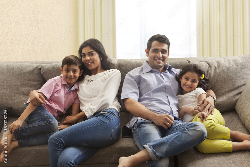 Portrait of Mother hugging son and father hugging daughter Portrait of Mother hugging son and father hugging daughter
