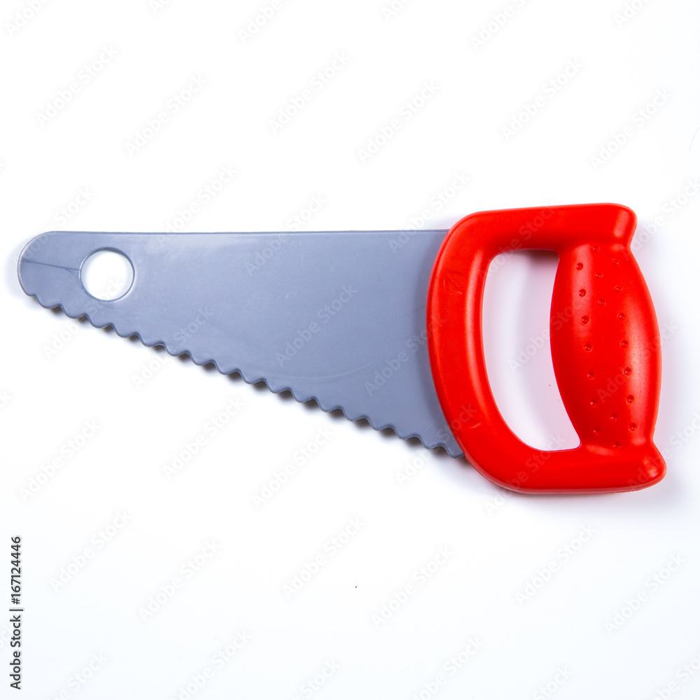 Kids construction toys tools, plastic toy red saw on white background Stock  Photo | Adobe Stock