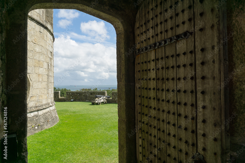 Looking through a doorway of a Castle to the outside