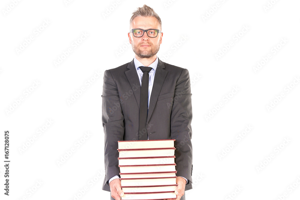 Portrait of middle-aged man in suit holding heap of books Portrait of middle-aged man in suit holding heap of books