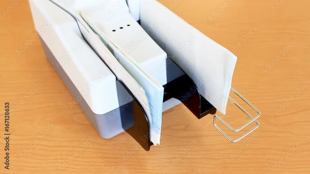 Check Scanner; Papers coming out of the scanner unit Check Scanner; Papers coming out of the scanner unit