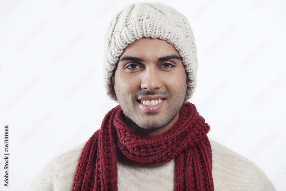 Close-up portrait of smiling young man wearing woolen hat Close-up portrait of smiling young man wearing woolen hat