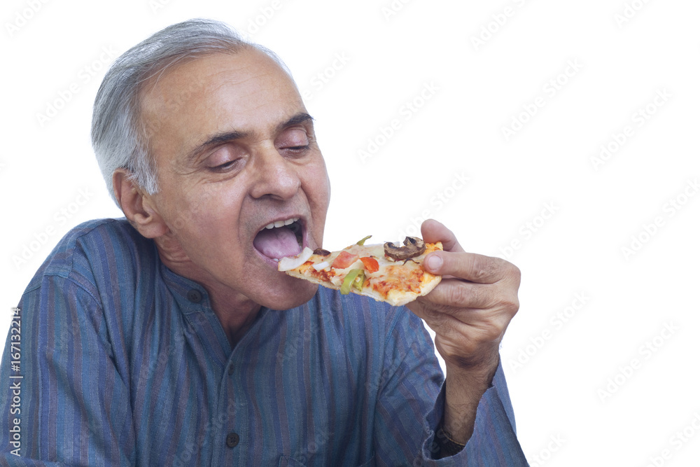 Close-up of senior man eating slice of pizza Close-up of senior man eating slice of pizza