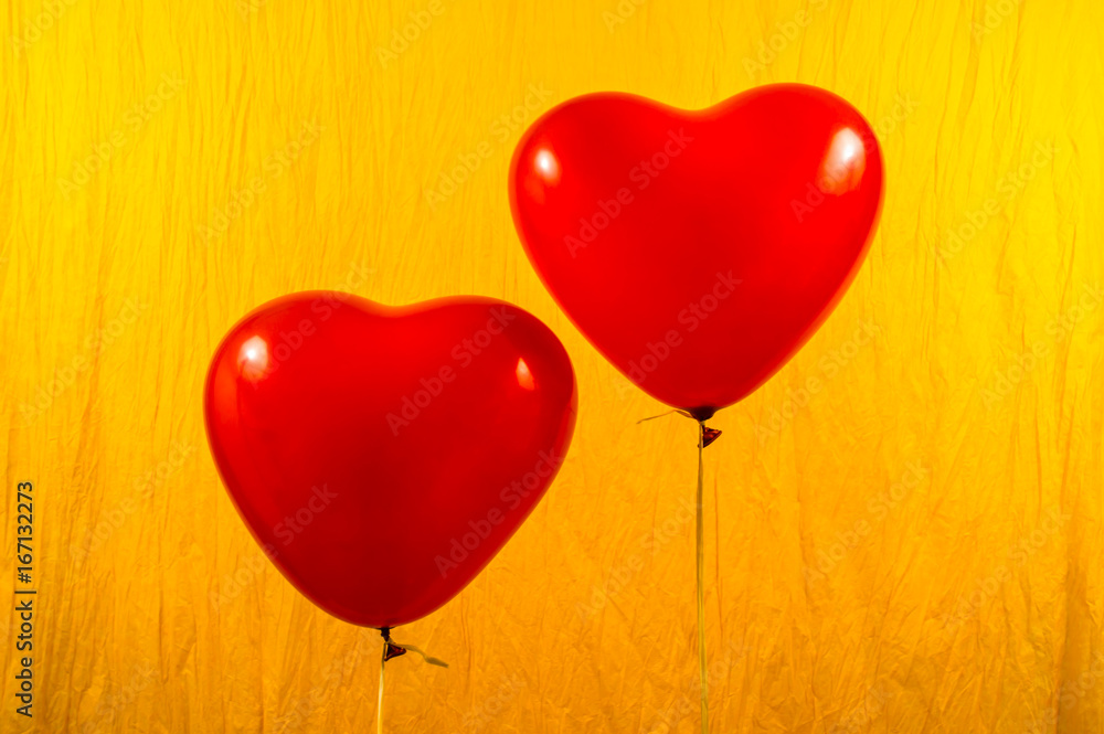 Red Heart Ballons on yellow background Red Heart Ballons on yellow background