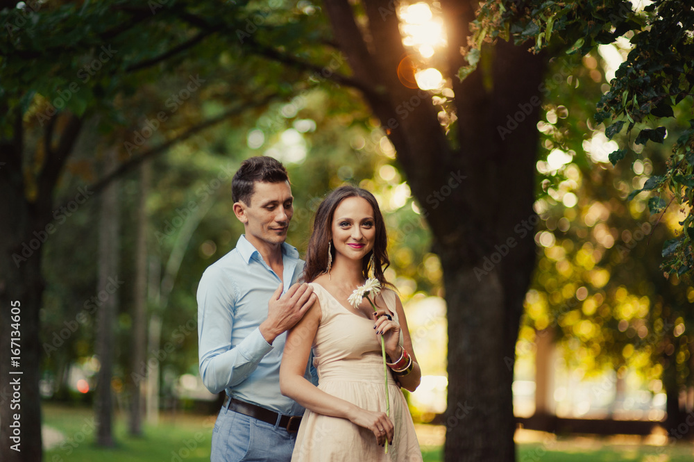 Fototapeta premium Young loving couple walking in the park