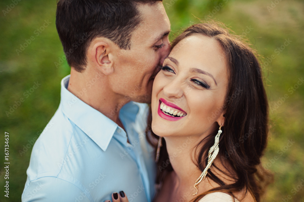 Fototapeta premium Young loving couple walking in the park