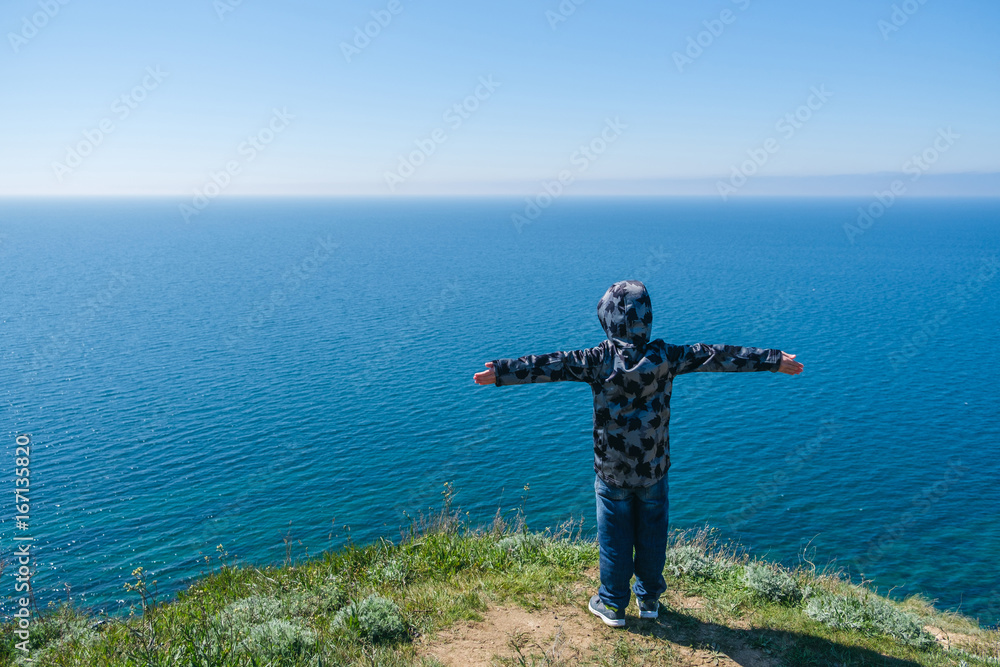 little boy climbing in mountains, kids travel