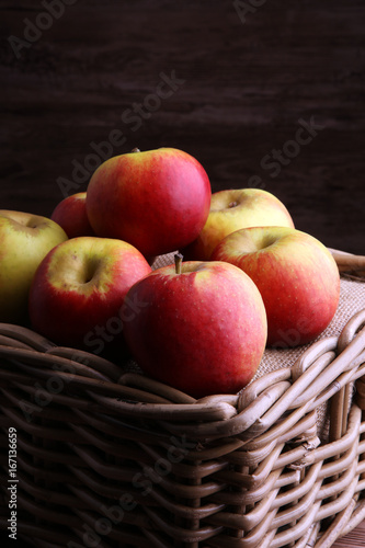 Ripe red apples on wooden background summer concept