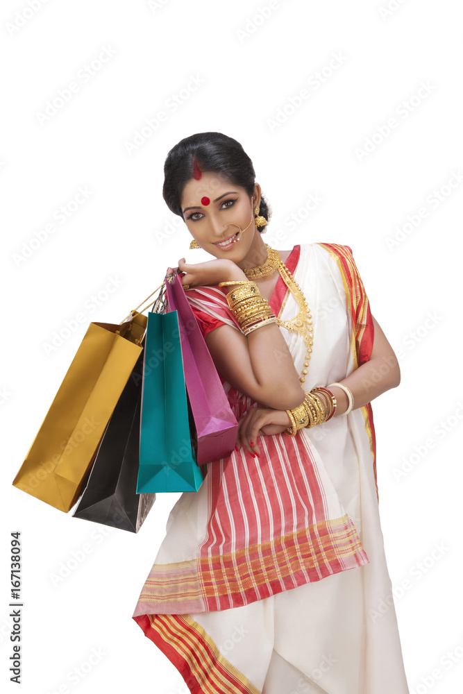 Portrait of Bengali woman holding shopping bags Portrait of Bengali woman holding shopping bags
