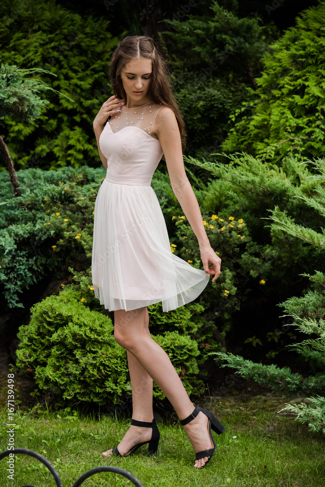Young beautiful woman in a light summer dress Young beautiful woman in a light summer dress