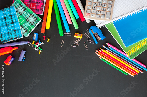 Back to school concept.School and office supplies on black background. Flat lay with copy space.