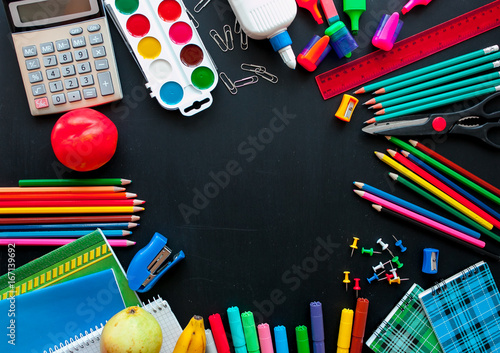 Back to school concept.School and office supplies on black background. Flat lay with copy space.