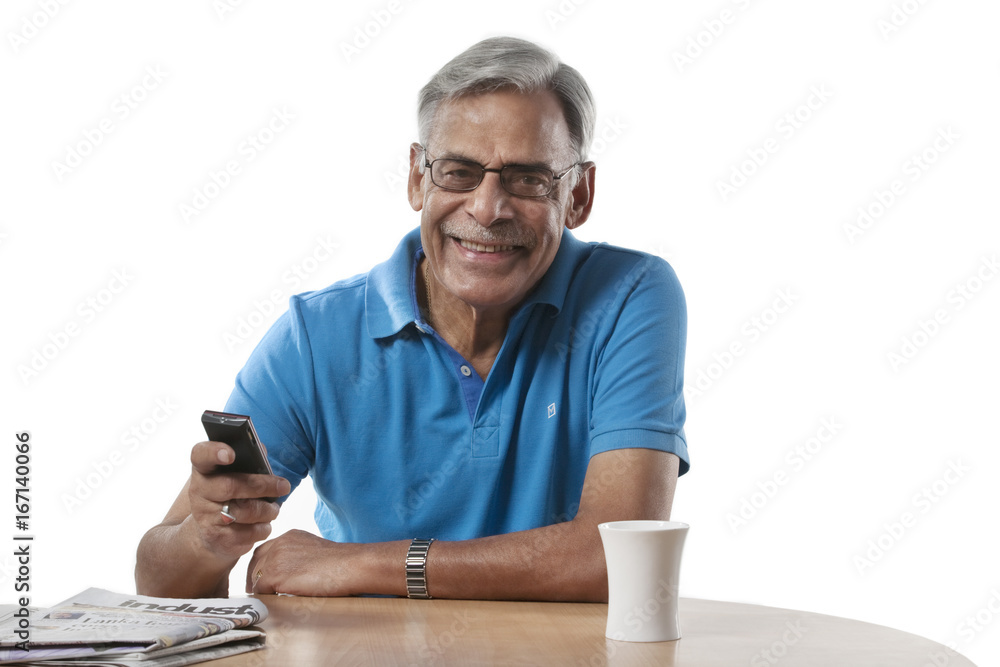 Portrait of an old man with a mobile phone 
