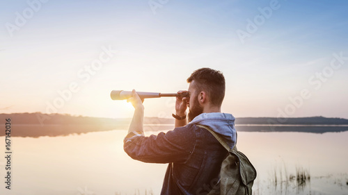 A guy with a telescope for nature... photo