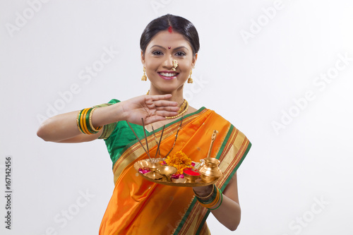 Portrait of a Maharashtrian woman holding a puja thali photo