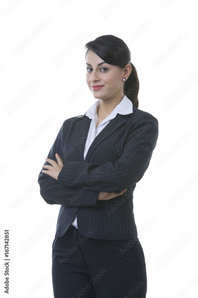 Portrait of well-dressed young businesswoman with arms crossed standing over white background Portrait of well-dressed young businesswoman with arms crossed standing over white background