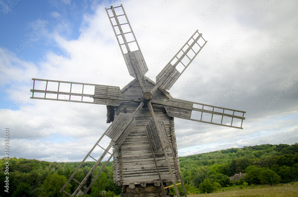 Wooden windmill in the forest