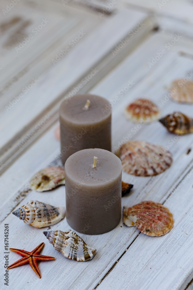 Two gray candles with seashells Two gray candles with seashells