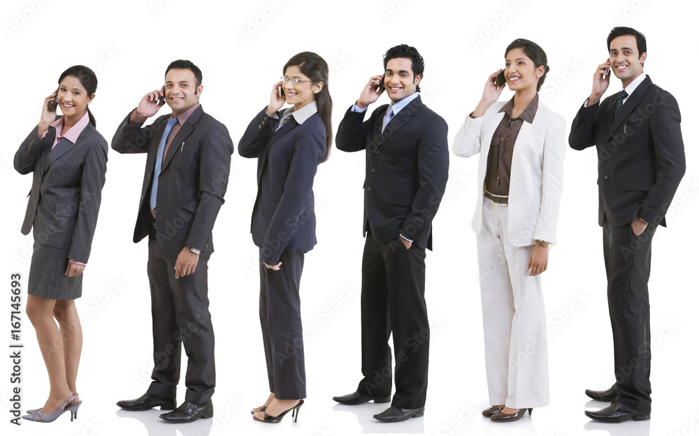 Business executives talking on a mobile phone Business executives talking on a mobile phone