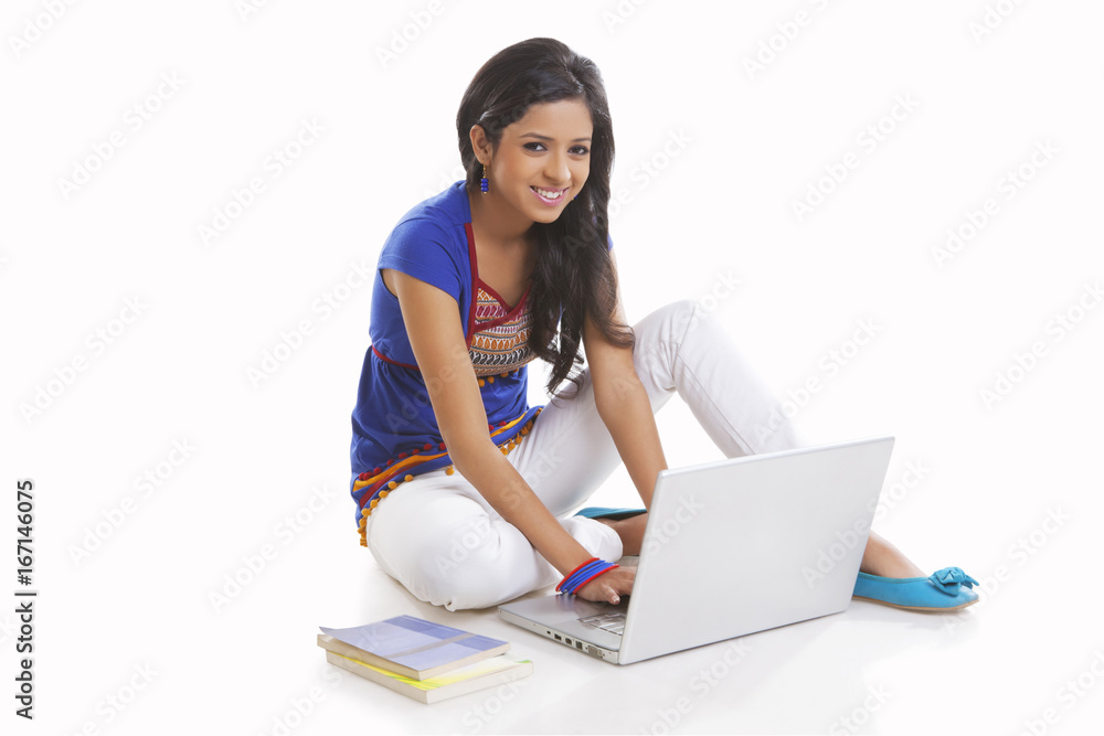 Portrait of girl working on laptop Portrait of girl working on laptop