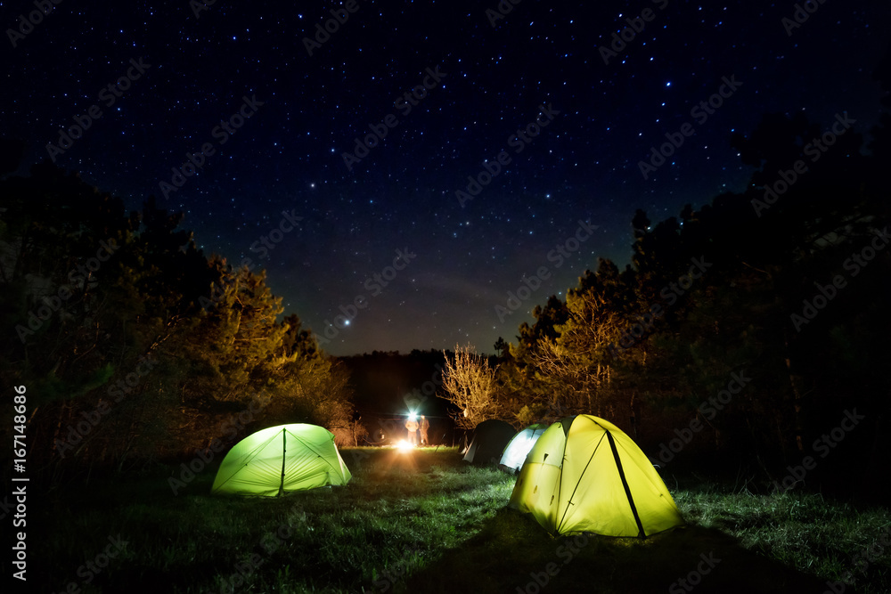 Multicolored tents under the starry sky