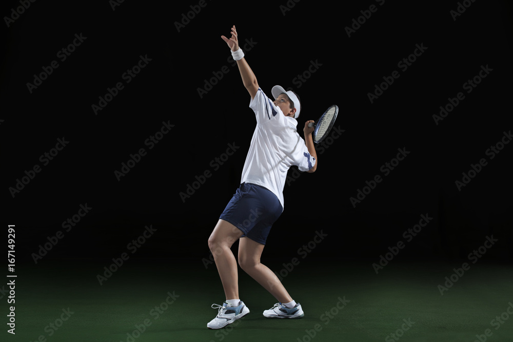 An Indian female player playing tennis against black background An Indian female player playing tennis against black background