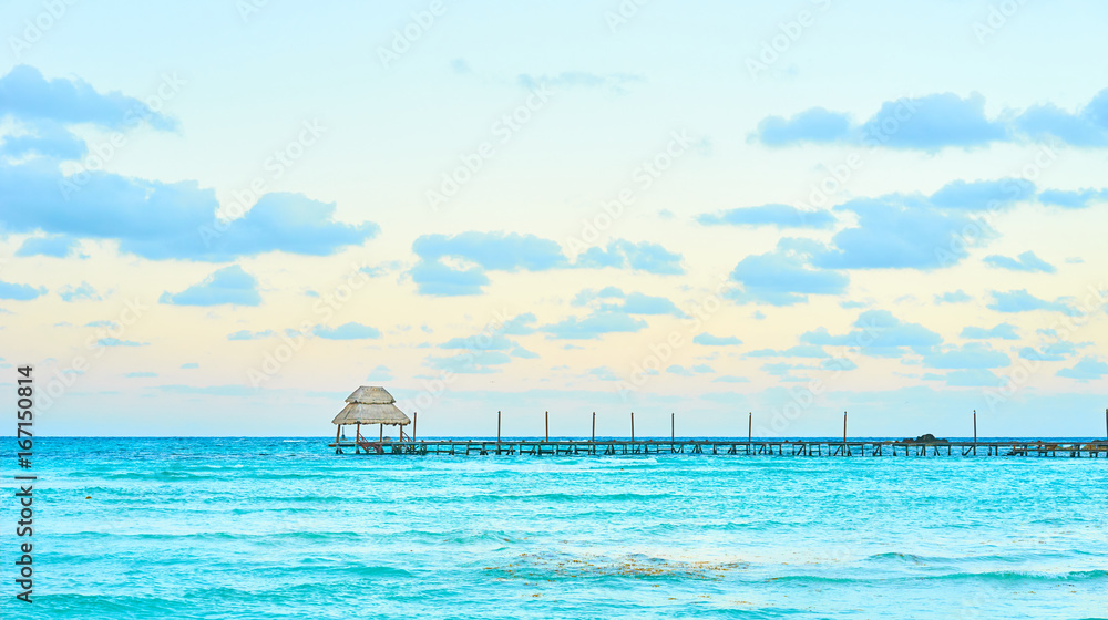 Exotic Beach, Paradise - Travel, Tourism and Vacations Concept. Landscape of Tropical Resort. Jetty near Cancun, Mexico