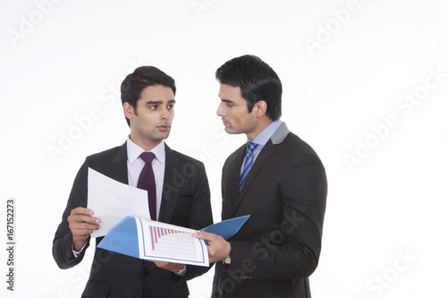 Two businessmen with a file