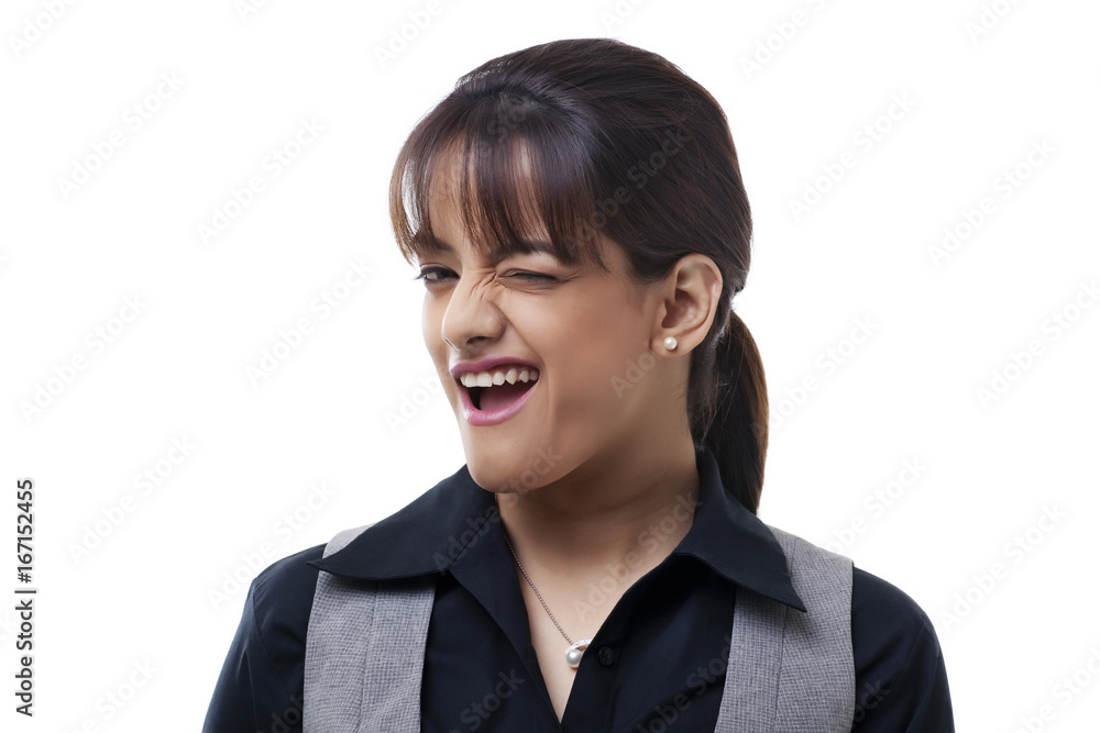 Flirtatious business woman winking on white background Flirtatious business woman winking on white background