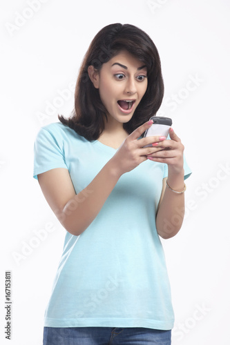 Woman surprised after reading sms