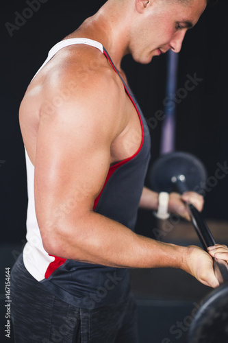 Attractive young muscular man working out his biceps © Vladimir