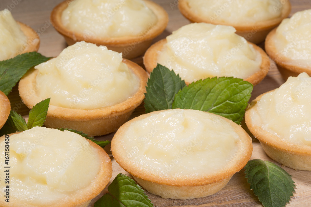 Tartlets with custard on the table Tartlets with custard on the table