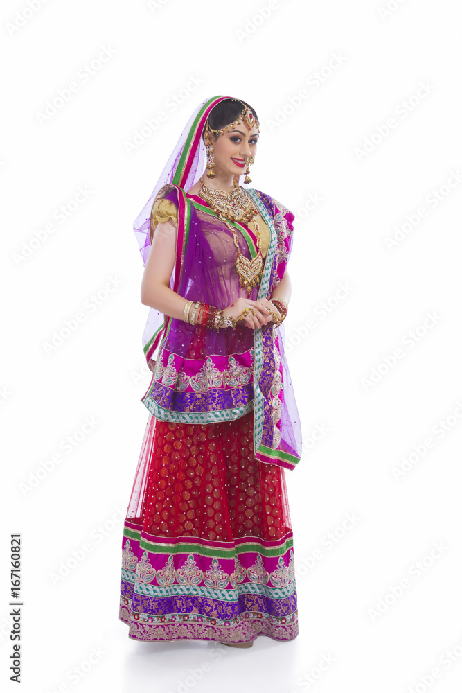 Full length portrait of beautiful Indian bride against white background Full length portrait of beautiful Indian bride against white background
