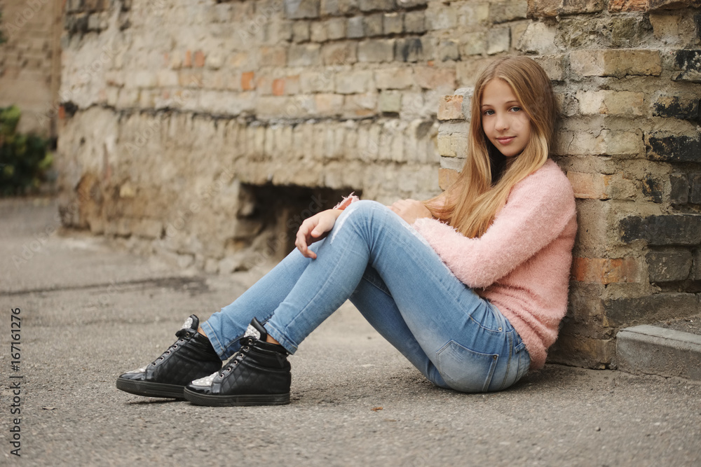 beautiful young girl posing on the street beautiful young girl posing on the street