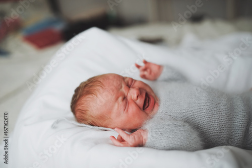 sweet newborn crying baby