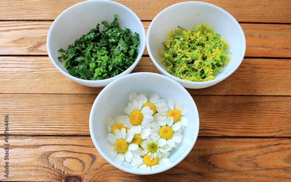 Chamomile pharmacy useful for health on a wooden table Chamomile pharmacy useful for health on a wooden table