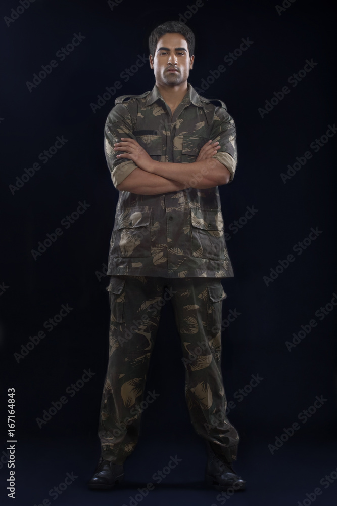 Handsome soldier with arms folded 